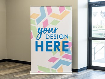 multi-colored banner stand with blue imprint