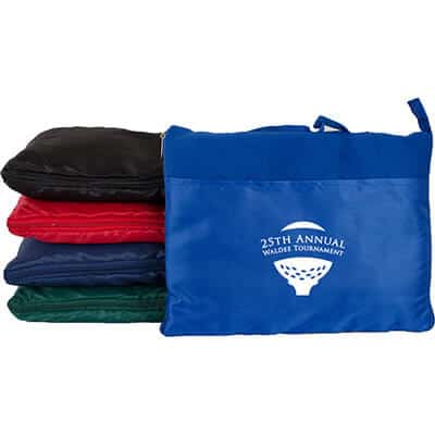 Custom printed royal blue fleece blanket that can fold into a zipper closure with a handle.