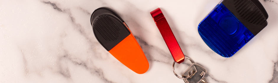 Blank orange and blue chip clips and a blank red bottle opener