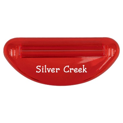 Red plastic toothpaste squeezer with a personalized logo.