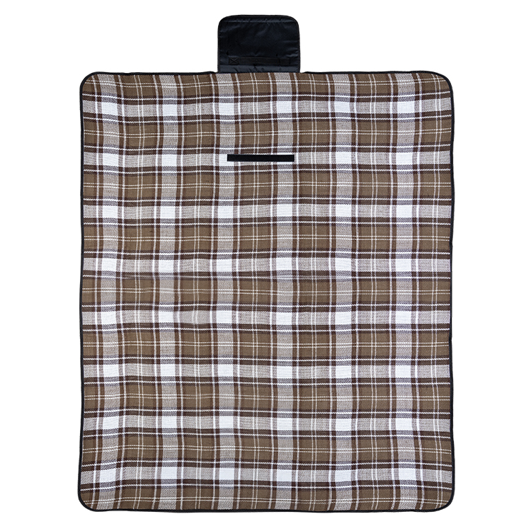 Plaid water-resistant polyester blanket with a handle and velcro closure.