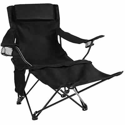 Reclining black folding chair with leg rest .