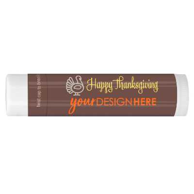 Brown background lip balm with orange leaves with a customized imprint.