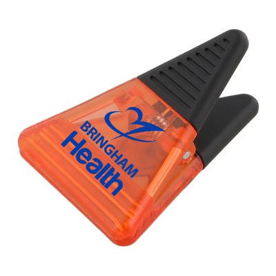 Plastic translucent orange triangle magnet clip with branding.