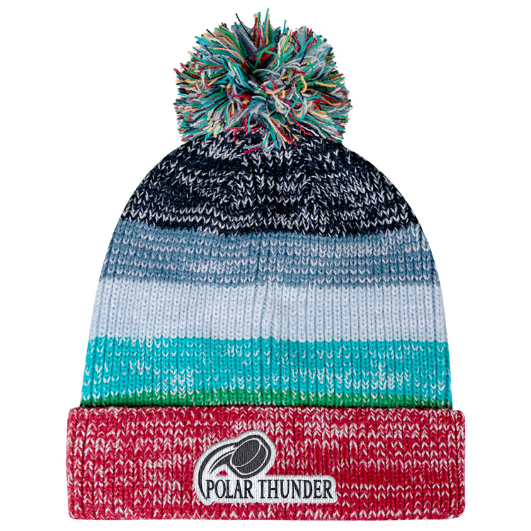 Multicolored striped beanie with rainbow thread pom and embroidered team logo on red cuff.