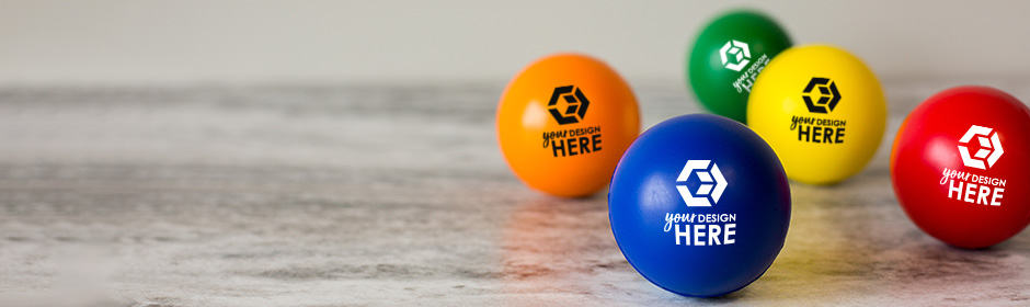 Muliple round custom stress balls in orange, green, blue, yellow, and red with black and white imprints