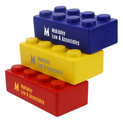 Foam yellow building block stress reliever with a printed logo.