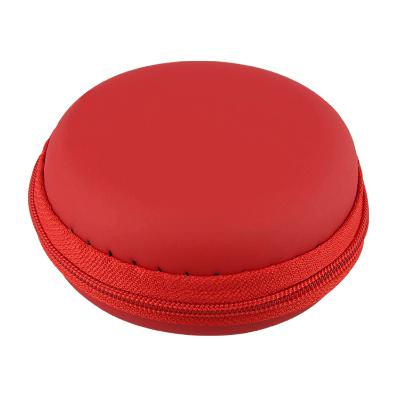 Synthetic red circular electronics pouch blank.