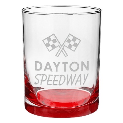 Red whiskey glass with engraved logo.
