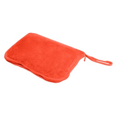 Blank orange blanket in a zip-up pillow travel bag.