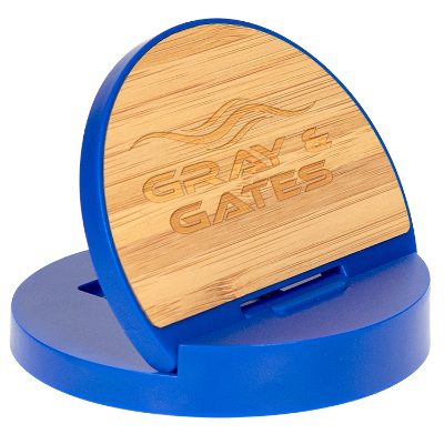 Blue plastic charging phone stand with a laser engraved imprint.