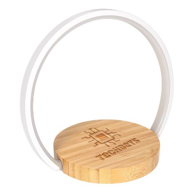 Bamboo wireless charger with a laser engraved logo.