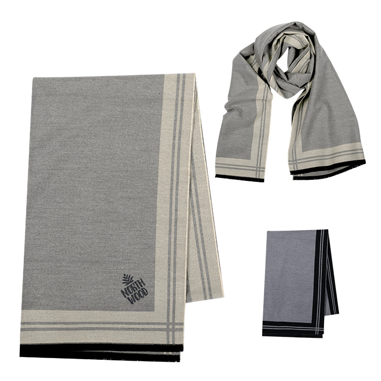 Gray and cream patterned scarf with black edge folded to show corner embroidery.