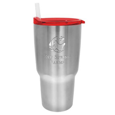 Stainless tumbler with red lid and engraved logo.