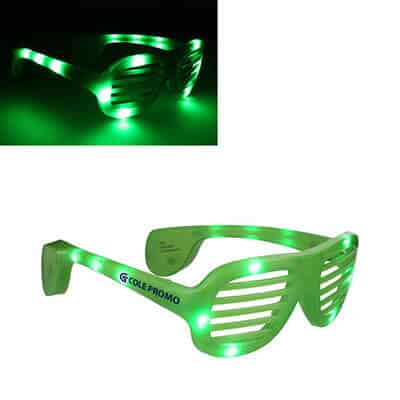 Plastic green slotted light up sunglasses with printed logo.