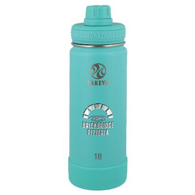 Teal bottle with engraved logo.