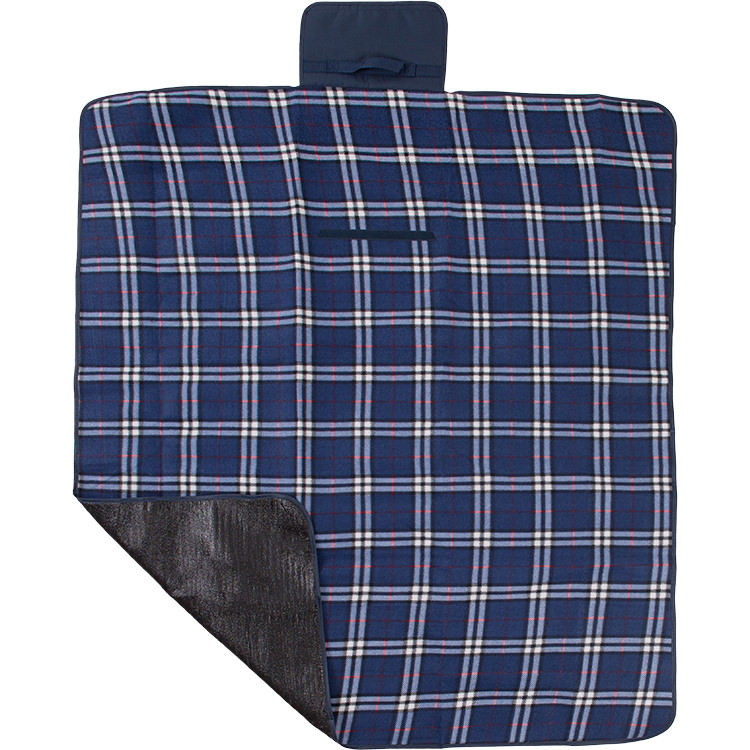 Patterned polyester blanket with attached handle.