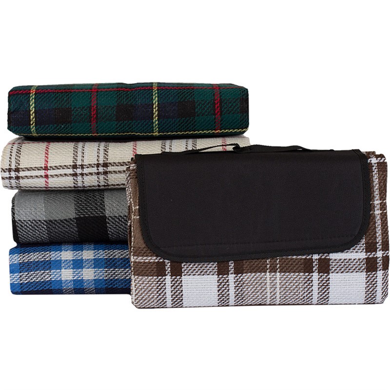 Blank plaid water-resistant polyester blanket with a handle and velcro closure.