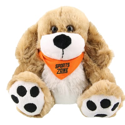 Plush and cotton dog with orange bandana with branded logo.