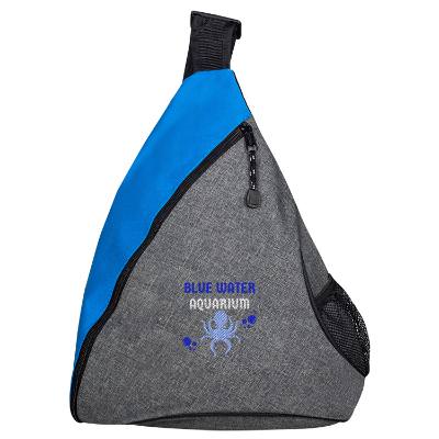 Blue two-tone slingpack with embroidered logo.