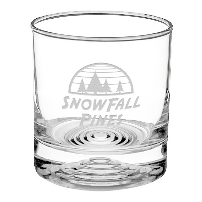Clear whiskey glass with engraved logo.