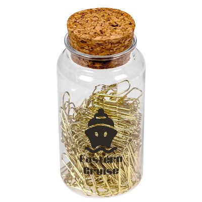 Plastic jar with a cork top holding gold paperclips with a custom imprint.