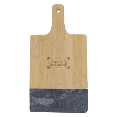 Black marble and bamboo cutting board with laser engraved custom logo.