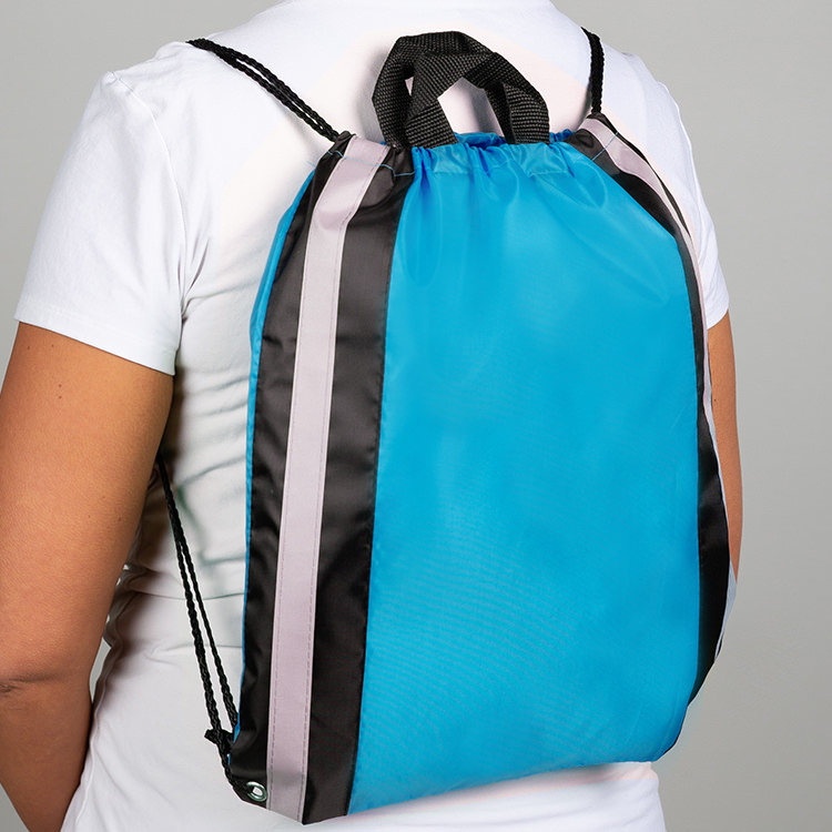 Polyester drawstring with reflective straps, top handle, and reinforced corners.