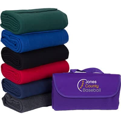 Full color logo on a purple fleece blanket that can fold within itself with attached handle.