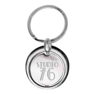 Metal circle keychain with engraved imprint.