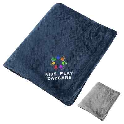 Blue etch textured blanket with embroidered design.