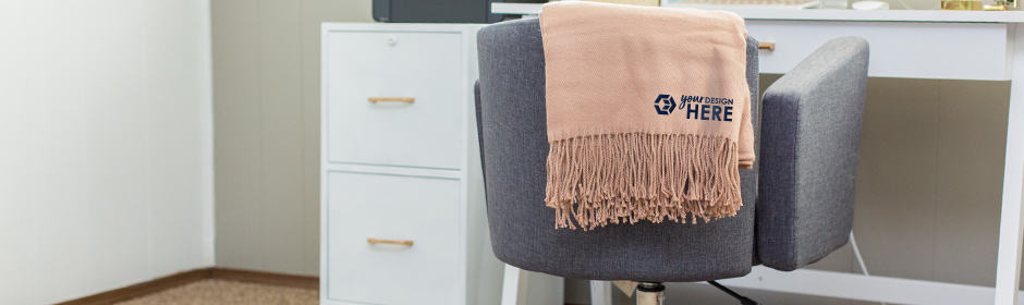 Pink branded blankets with blue imprint