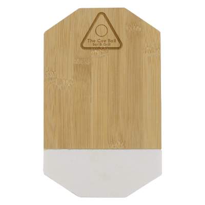 Octogonal white marble and bamboo cutting board with laser engraved promotional logo.