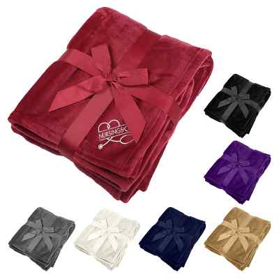 Red plush blanket with custom design.